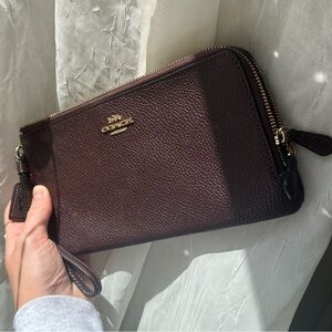 Large Oxblood Coach long corner zip wristlet wallet, like new